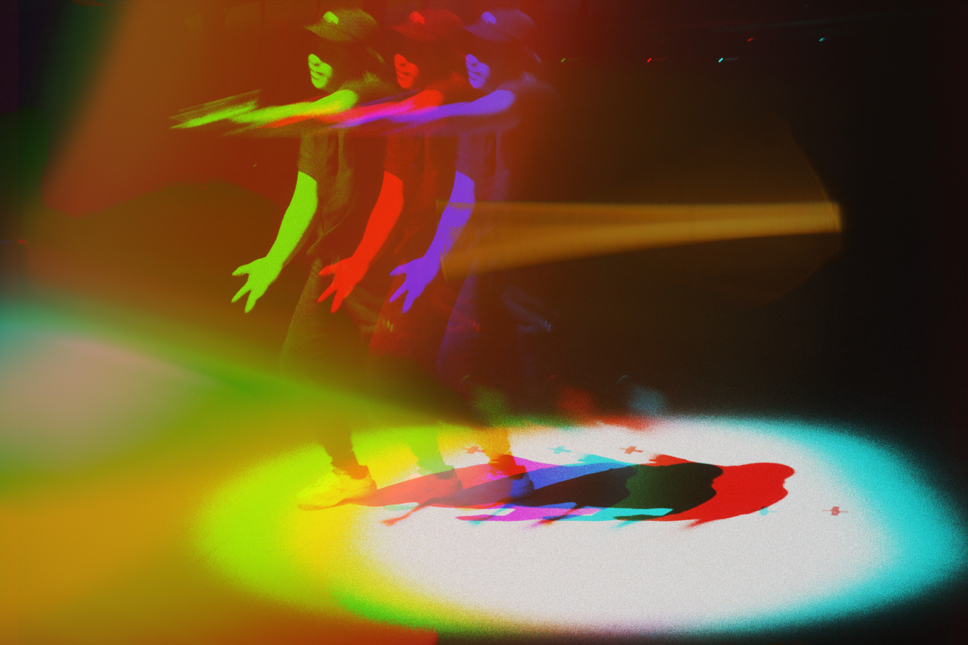 Student dancing in a spotlight.