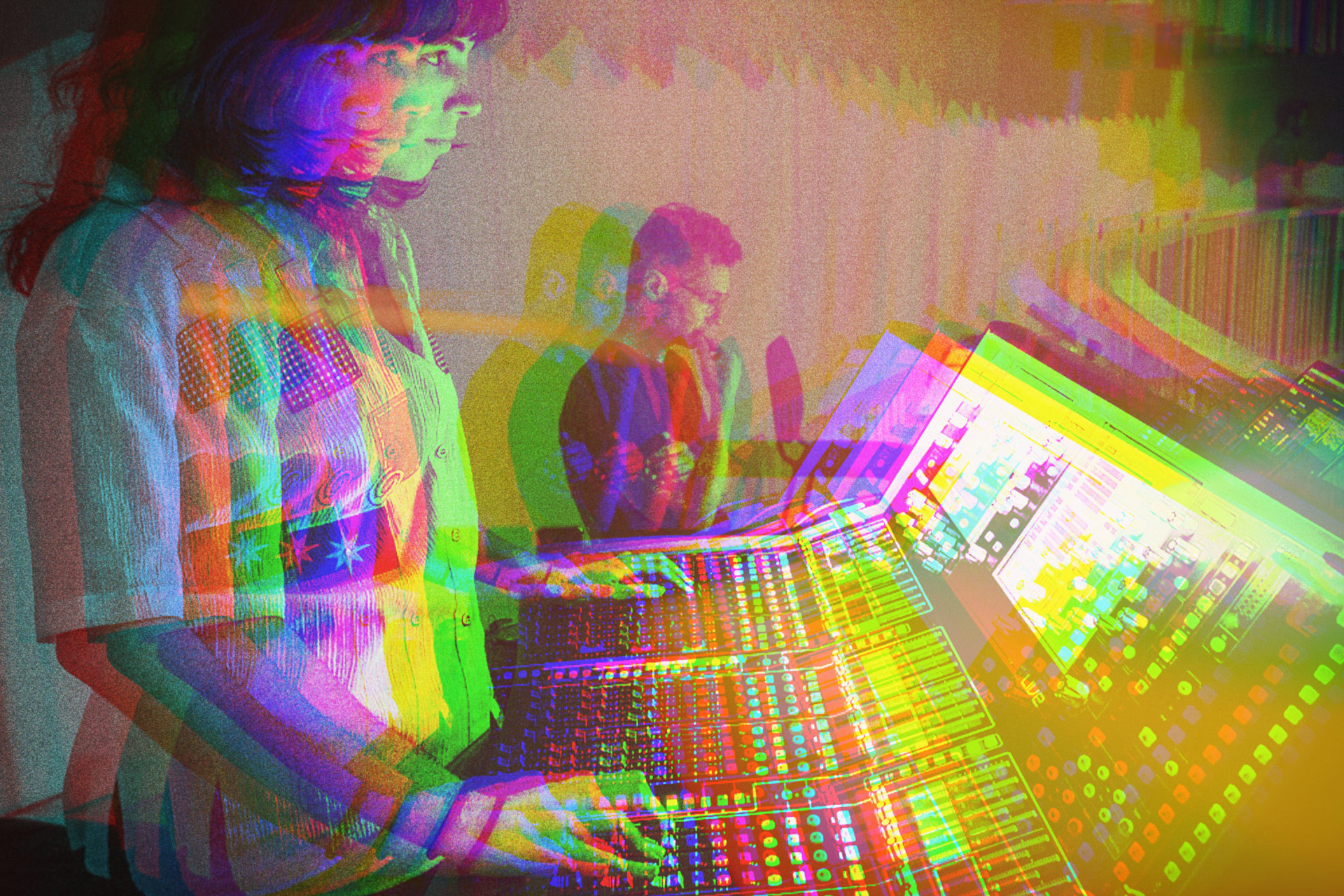 Student handling a soundboard with faculty observing.