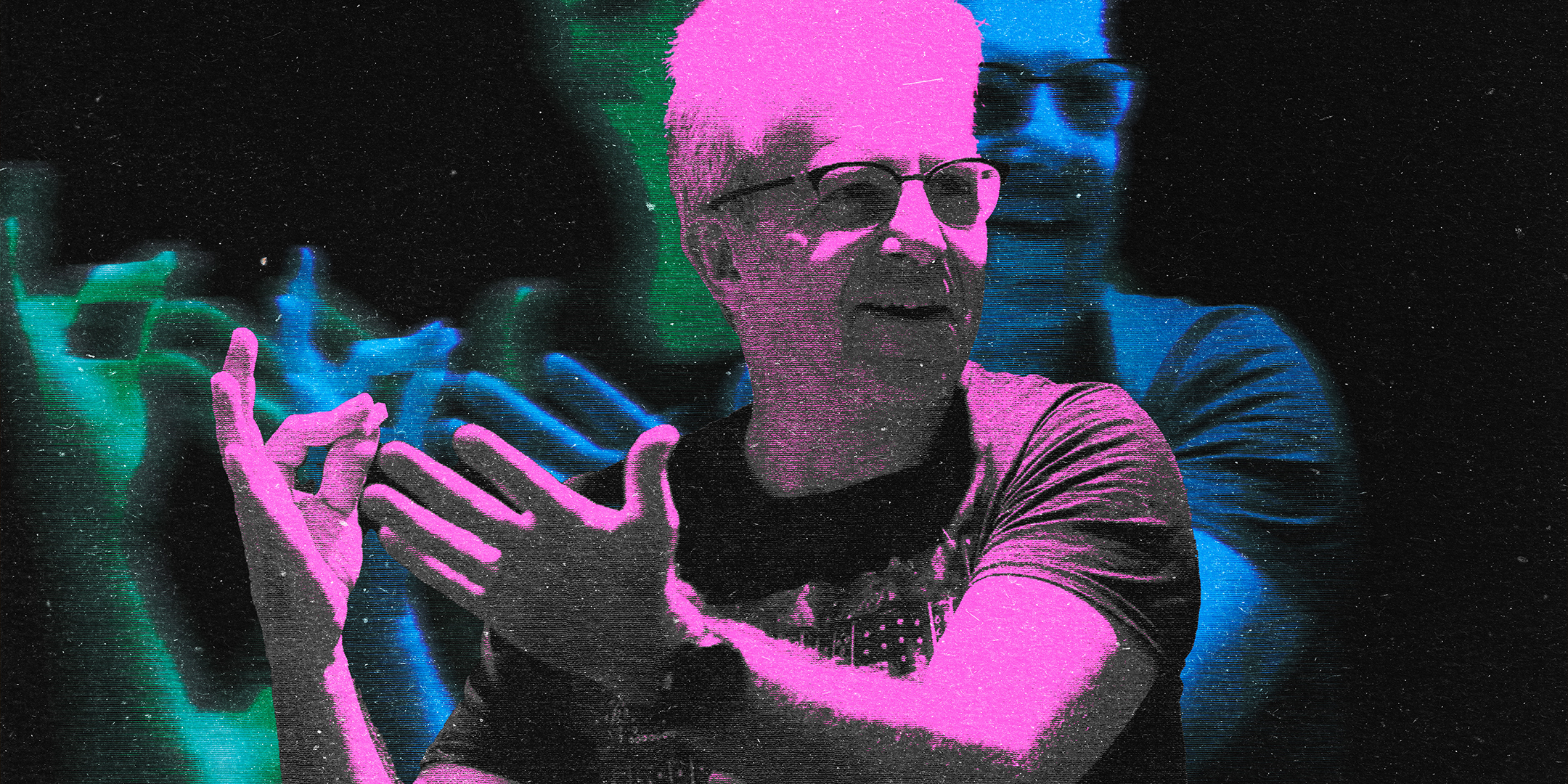Person expressing hand gestures of excitement while speaking.